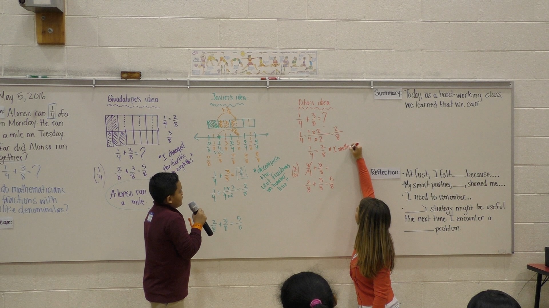 A student explains his mathematical idea as a teacher records the student's thoughts on a white board